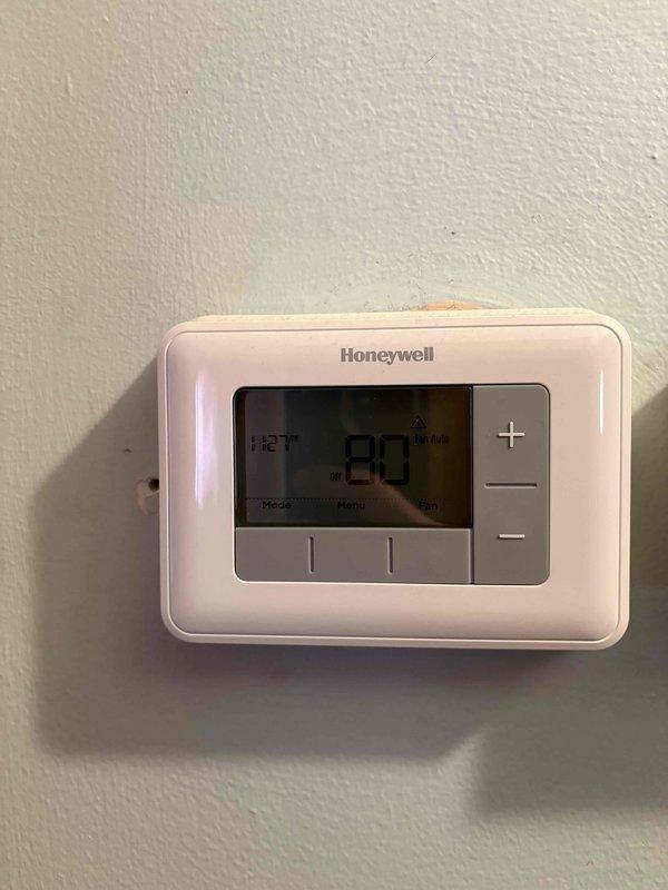 Responded to service call for outdoor HVAC unit failing to activate despite thermostat display functioning normally. Upon arrival, assessed Honeywell thermostat showing 80°F setpoint and inspected outdoor condenser unit located in side yard. After comprehensive system evaluation and discussing equipment age, condition, and repair costs versus replacement benefits, provided detailed estimate for complete HVAC system replacement to resolve operational failure and improve long-term reliability and efficiency.