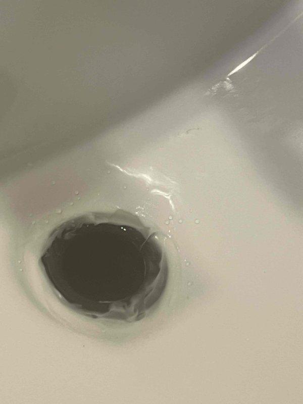 Responded to service call for leaking one-piece toilet that required resetting. Upon arrival, found toilet had been previously installed by homeowner but was not properly seated, resulting in water leakage at the base. Due to tight clearance in the installation area, carefully removed toilet and inspected flange and wax ring. Cleaned mounting surface, installed new wax ring, and properly reset toilet ensuring level placement and secure seal. Tightened closet bolts to manufacturer specifications and tested for leaks. Verified proper operation and confirmed no water seepage around base.
