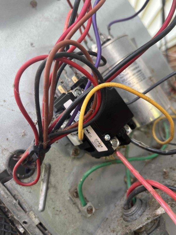 # HVAC Service Completed

Responded to no cooling call on 10+ year old air conditioning system. Upon arrival, confirmed outdoor condensing unit fan was not operating. Performed diagnostic assessment of outdoor unit electrical components.

Inspected contactor, capacitor, and associated wiring connections at outdoor unit. Found failed dual run capacitor preventing condenser fan motor from starting. Removed defective capacitor and installed new replacement unit with proper microfarad rating for both compressor and fan motor. Verified all wire connections were secure at contactor terminals and capacitor. Tested system operation and confirmed condenser fan motor now running properly. Unit cooling normally at time of departure.