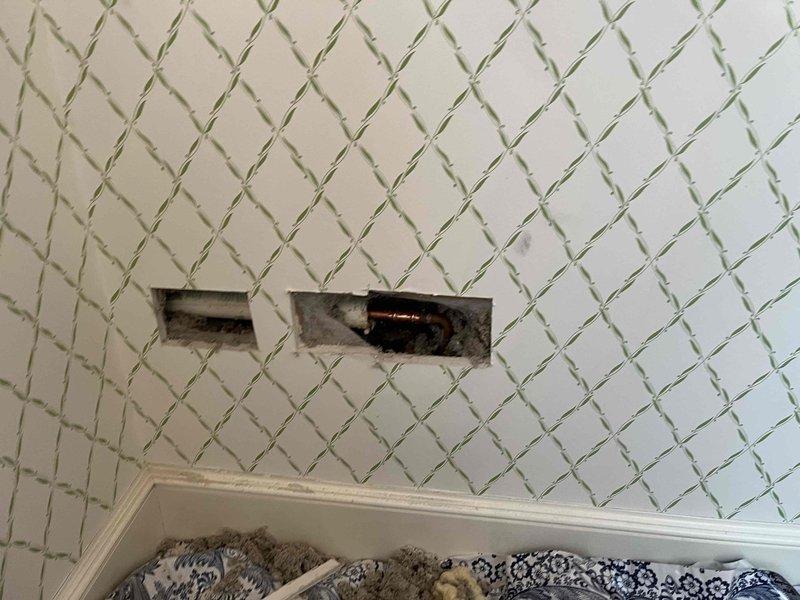 Replaced outdoor water spigot on exterior wall with frost-free anti-siphon hose bib. Created interior wall access point through textured drywall to reach supply line, installed new fixture, and verified proper operation with no leaks detected at connection points or valve assembly.