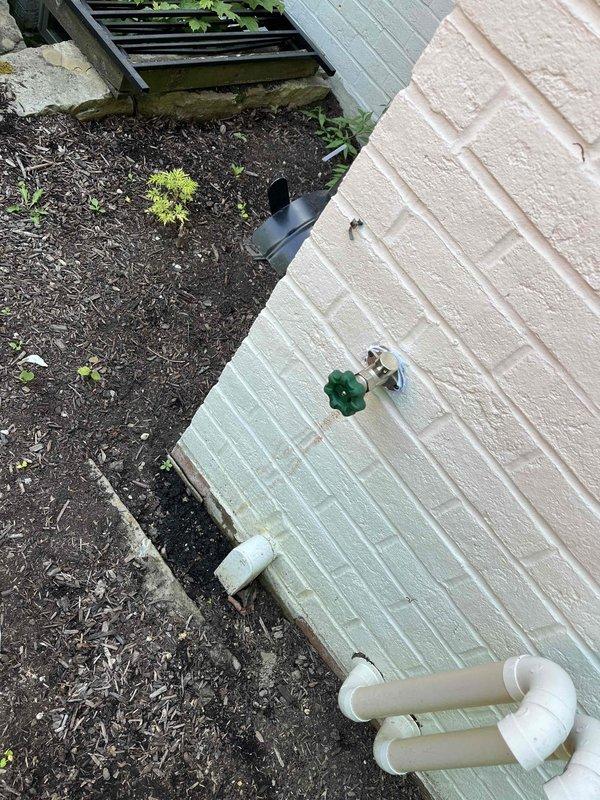 Replaced outdoor water spigot on exterior wall with frost-free anti-siphon hose bib. Created interior wall access point through textured drywall to reach supply line, installed new fixture, and verified proper operation with no leaks detected at connection points or valve assembly.