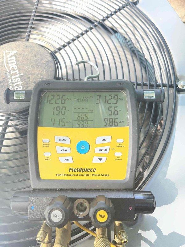 Completed routine cooling maintenance for club member. Performed system diagnostics using refrigerant manifold gauge to verify proper operating pressures and temperatures, with readings indicating system performing within normal parameters. Documented equipment conditions with photos for service records.