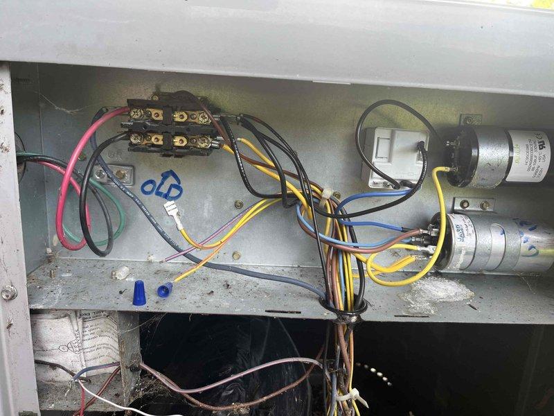 Responded to no cooling complaint with unit blowing hot air. Upon arrival, performed diagnostic inspection of air handler system. Found electrical control panel and blower compartment in poor condition with significant dirt accumulation, debris buildup, and evidence of deferred maintenance. Observed corroded copper refrigerant lines, aged wiring with signs of wear, and dirty blower assembly affecting system performance. Inspected capacitors, electrical connections, and control components within the panel. System showed clear indication of lack of regular preventative maintenance contributing to current failure. Recommended comprehensive cleaning, electrical component evaluation, and full system assessment to restore proper cooling operation.