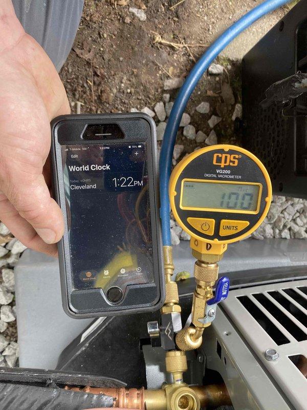 Completed full HVAC system installation per approved application #7025523. Installed electrical disconnect box on exterior wall, verified level installation and proper mounting. Performed system evacuation and vacuum test on refrigerant lines, achieving proper micron reading of 10.0 on digital vacuum gauge, confirming system integrity and readiness for refrigerant charge.