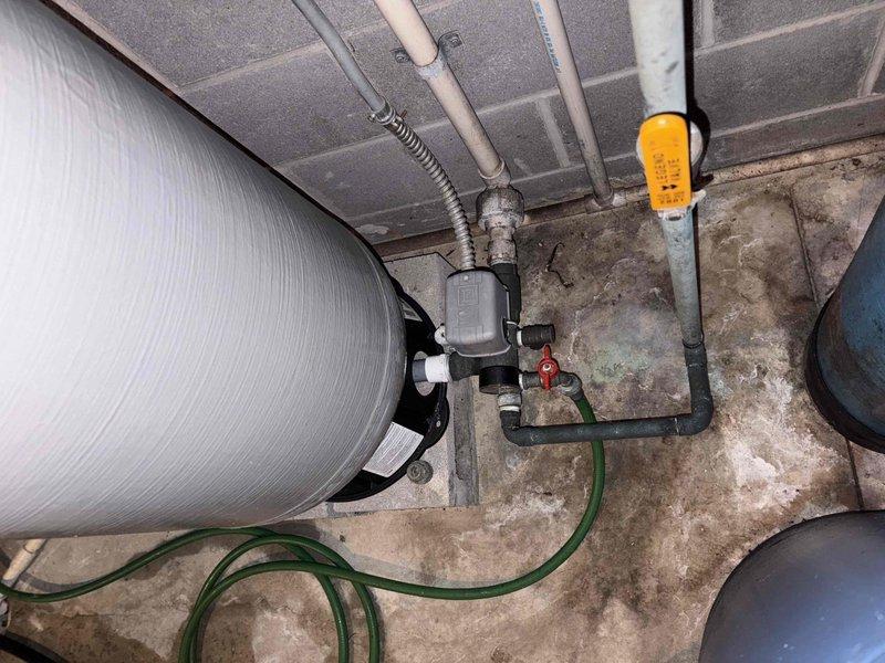 Conducted comprehensive HVAC system assessment for complete replacement of 30-year-old furnace and non-operational air conditioning system. Evaluated existing outdoor condenser unit positioned on exterior concrete pad and inspected basement mechanical room containing water heater and associated utility infrastructure to determine optimal equipment specifications and installation requirements for new heating and cooling systems.