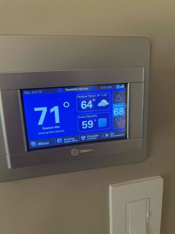 Responded to service call for AC system cycling issue where compressor would run for only 30 seconds before shutting off while blower fan continued to operate, preventing thermostat from reaching set point below 73 degrees. Upon arrival, verified thermostat operation and settings, noting system was holding at 71 degrees but unable to reach desired cooling temperature. Inspected outdoor condensing unit and electrical components, including capacitor connections and wiring terminals. Found capacitor showing signs of age and corrosion with potential degradation affecting compressor operation. System was recently installed with soft start kit previously added to assist with compressor startup. Documented thermostat display readings and electrical component condition for further diagnosis and recommended capacitor replacement to restore proper system cycling and cooling performance.