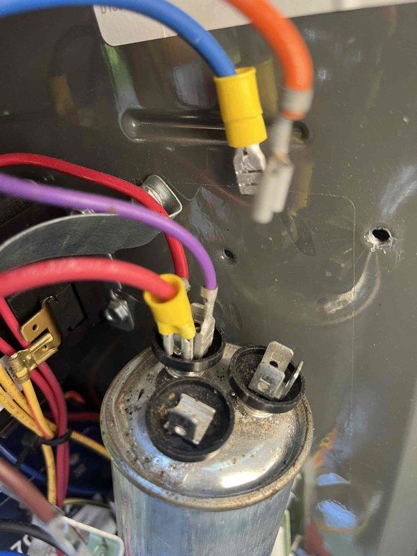 Responded to service call for AC system cycling issue where compressor would run for only 30 seconds before shutting off while blower fan continued to operate, preventing thermostat from reaching set point below 73 degrees. Upon arrival, verified thermostat operation and settings, noting system was holding at 71 degrees but unable to reach desired cooling temperature. Inspected outdoor condensing unit and electrical components, including capacitor connections and wiring terminals. Found capacitor showing signs of age and corrosion with potential degradation affecting compressor operation. System was recently installed with soft start kit previously added to assist with compressor startup. Documented thermostat display readings and electrical component condition for further diagnosis and recommended capacitor replacement to restore proper system cycling and cooling performance.
