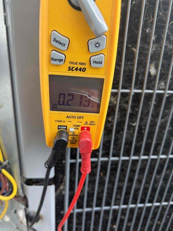 Responded to callback for AC not cooling following previous maintenance. Upon arrival, performed diagnostic testing with digital multimeter to measure operating temperatures and verify system performance. Readings indicated potential issues with electrical components. Inspected condensing unit and found capacitor with specifications of 2.5mfd operating within acceptable parameters. Verified all electrical connections at capacitor terminals and contactor, ensuring proper wire routing and secure terminations per manufacturer specifications. All wiring color codes confirmed correct for compressor and fan motor circuits. System tested and verified operational following inspection.