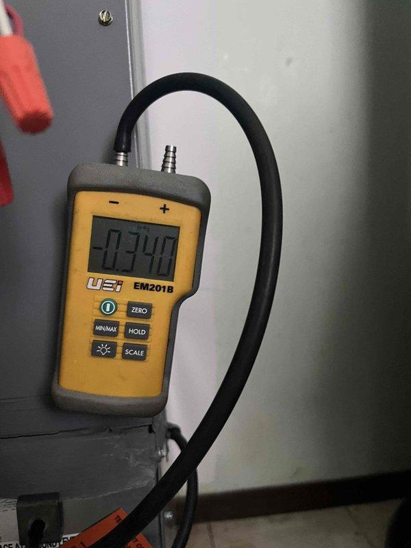 Performed diagnostic evaluation on 1-year-old heat pump system following previous fall maintenance notation. Measured static pressure at -0.340 using digital manometer and verified supply register airflow and temperature output. Unit is currently operating in heating mode with proper output; however, refrigerant charge verification remains pending until ambient temperatures exceed 55°F to allow accurate cooling mode assessment per manufacturer specifications.