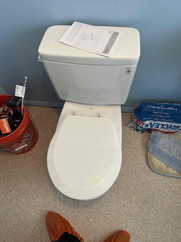 Responded to service call for malfunctioning downstairs toilet with failed internal components and leaking faucet. Removed and replaced defective toilet unit with new two-piece porcelain fixture. Installed new toilet with proper sealing, connected water supply line, and verified proper flush operation and water flow. Addressed leaking downstairs faucet issue to restore proper function.
