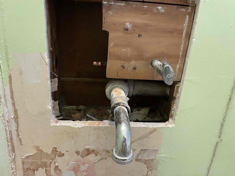Responded to emergency plumbing call for broken hot water line serving bathroom sink. Upon arrival, main water supply had already been shut off to prevent further water damage. Accessed plumbing infrastructure through existing wall access panel and attic/crawl space area to locate and assess the damaged copper pipe section. Identified compromised hot water supply line with failed connection point requiring immediate replacement. Removed deteriorated pipe section and installed new copper piping with proper fittings and connections to restore hot water service to bathroom sink. Additionally replaced exterior hose spigot as requested, ensuring proper threading and secure mounting to prevent future leaks. Tested all connections for leaks, verified water pressure, and confirmed proper operation of both the bathroom sink hot water supply and new exterior spigot before restoring main water supply to the property.