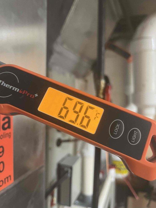 Completed full HVAC system installation in basement mechanical room, including new furnace/air handler unit and associated ductwork. Installed PVC venting system with proper configuration, verified system operation, and confirmed temperature readings at 69.6°F using calibrated digital thermometer. All equipment labeled and secured per manufacturer specifications with proper clearances maintained for service access.