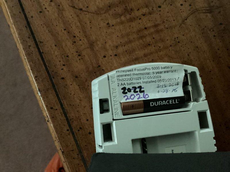 Responded to service call for air conditioning system blowing hot air. Inspected Honeywell FocusPro 5000 battery-operated thermostat (Model TH522UD1029) and verified display functionality and battery condition. Accessed attic-mounted Unicel System air handler and evaluated overall system condition. Documented existing equipment age and configuration. Provided comprehensive estimate for complete HVAC system replacement due to equipment age and performance issues.