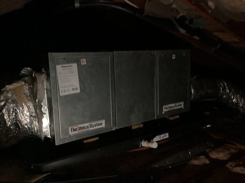 Responded to service call for air conditioning system blowing hot air. Inspected Honeywell FocusPro 5000 battery-operated thermostat (Model TH522UD1029) and verified display functionality and battery condition. Accessed attic-mounted Unicel System air handler and evaluated overall system condition. Documented existing equipment age and configuration. Provided comprehensive estimate for complete HVAC system replacement due to equipment age and performance issues.