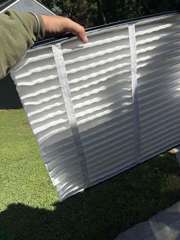 Completed scheduled cooling system maintenance as part of recurring membership service. Inspected and replaced air filter, which was found in clean condition with intact pleated media and reinforcing frames. Verified proper airflow through ventilation grille and confirmed mesh screening remained intact with no debris obstruction.
