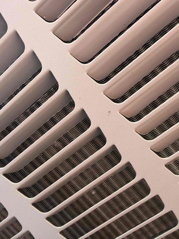 Completed scheduled cooling system maintenance as part of recurring membership service. Inspected and replaced air filter, which was found in clean condition with intact pleated media and reinforcing frames. Verified proper airflow through ventilation grille and confirmed mesh screening remained intact with no debris obstruction.