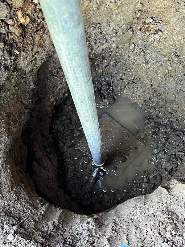Excavated existing hose hydrant location and installed new frost-free yard hydrant assembly. Removed old piping, connected new unit to existing water supply line using appropriate PVC fittings, and backfilled excavation with gravel base for proper drainage and stability. Unit tested and operational upon completion.
