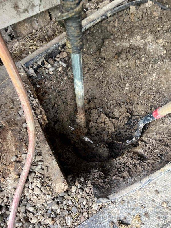 Excavated existing hose hydrant location and installed new frost-free yard hydrant assembly. Removed old piping, connected new unit to existing water supply line using appropriate PVC fittings, and backfilled excavation with gravel base for proper drainage and stability. Unit tested and operational upon completion.