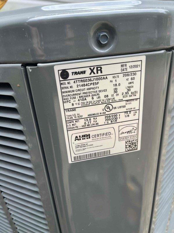 Completed routine cooling maintenance member visit on Trane XR model 4TTR6036J1000AA condenser unit (manufactured 12/2021). Performed standard system diagnostics including electrical testing with multimeter, verifying proper voltage and amperage readings, and conducted comprehensive visual inspection of unit components and specifications. All measurements within normal operating parameters for 208/230V, 60Hz system with 18.0 amp draw. Unit operating efficiently and ready for continued service.