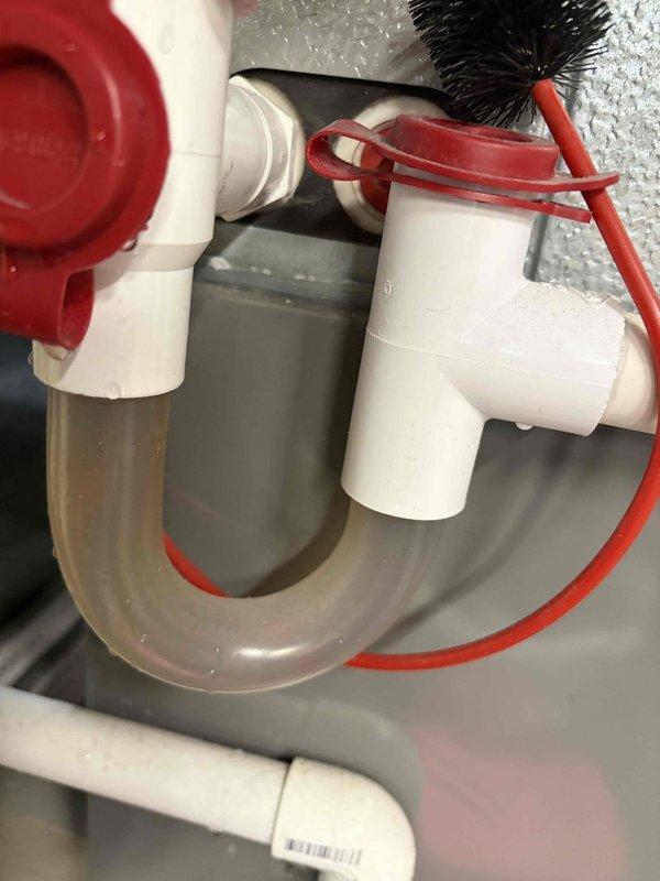 Completed routine cooling maintenance for club member's air handler system. Performed comprehensive inspection of HVAC unit, replaced air filter with new pleated media filter, and cleared condensate drain line assembly. Verified proper drainage operation through P-trap configuration and ensured all plumbing connections were secure and functioning correctly.