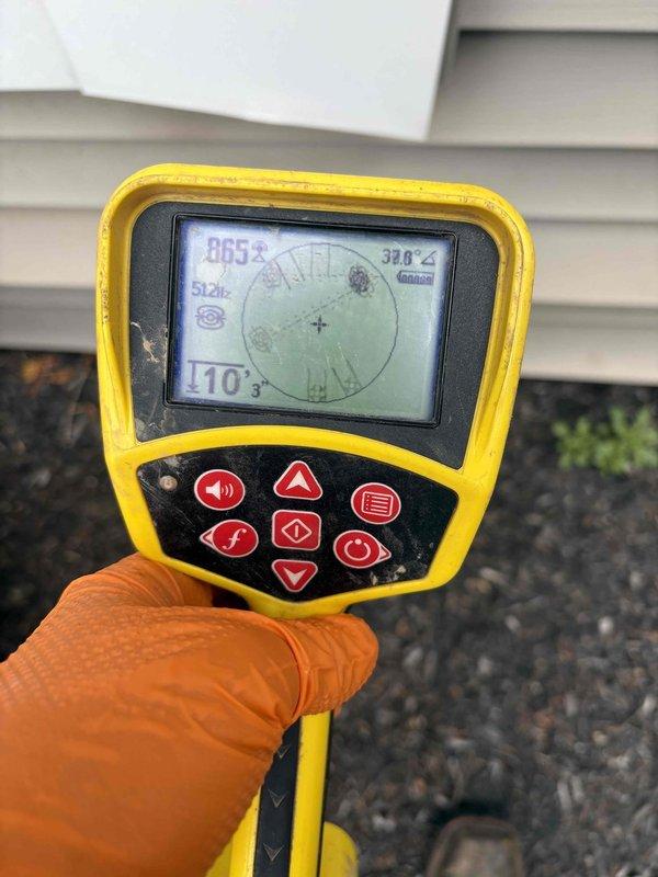 Performed sewer line camera inspection to assess condition and identify potential causes of backup issues. Utilized electronic locating equipment to trace and map underground sewer line path, documenting depth and location measurements at 110 feet 3 inches from access point. Inspection revealed system conditions requiring preventative maintenance recommendations to mitigate future backup risks.