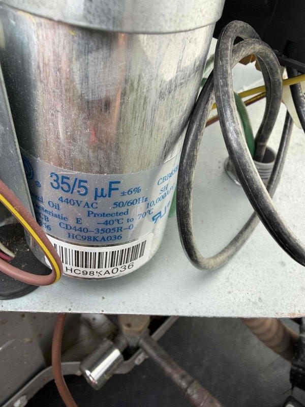 Completed cooling maintenance club visit on air handler system. Performed routine inspection and maintenance procedures per membership agreement. Documented equipment condition including dual-run capacitor (35/5 μF, 440V AC) showing signs of age with surface discoloration and oxidation on casing. Inspected and photographed fuse block assembly with dual copper fuses in working condition. All electrical connections verified secure, system operational at time of departure.