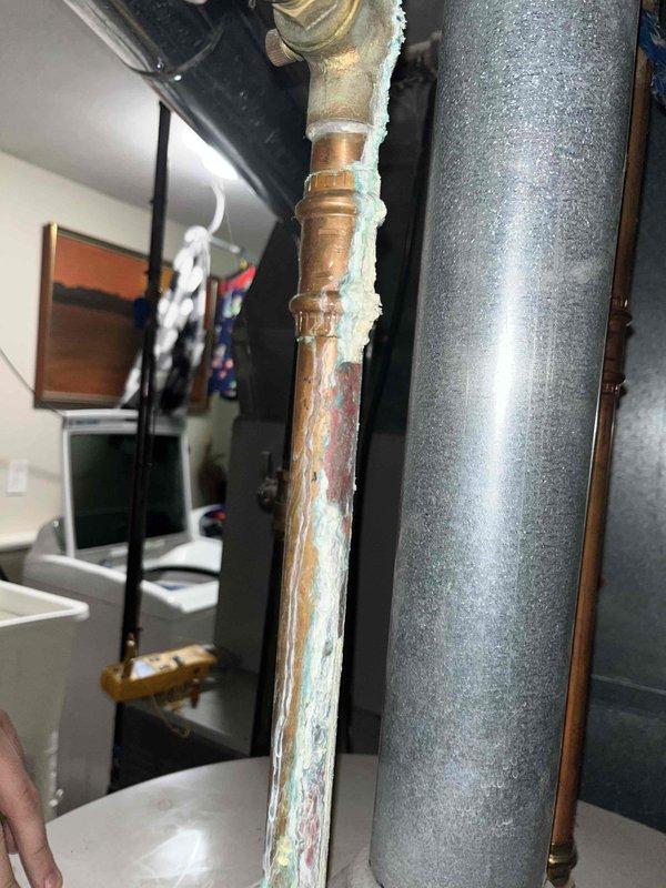 Completed preventative maintenance tune-up on 6-year-old American Standard HVAC system. Performed standard system diagnostics, verified thermostat operation and display functionality, inspected all accessible components including refrigerant lines and connections. Noted significant corrosion and mineral buildup on copper condensate drain line requiring future attention, though system currently operating within normal parameters.