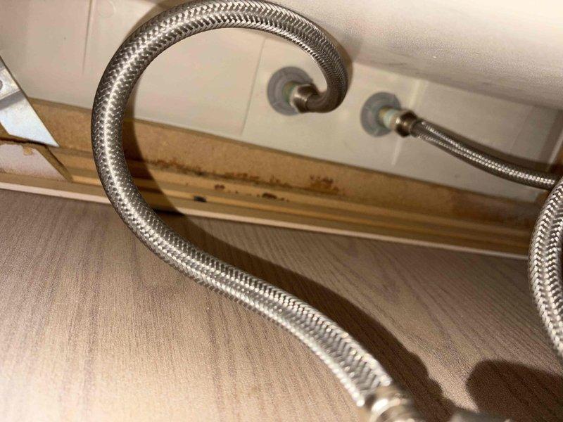 Replaced laundry sink and faucet assembly in residential setting. Removed existing fixtures and installed new sink basin with corresponding faucet hardware. Connected braided stainless steel flexible supply lines to wall-mounted shut-off valves with proper sealing to ensure leak-free operation.
