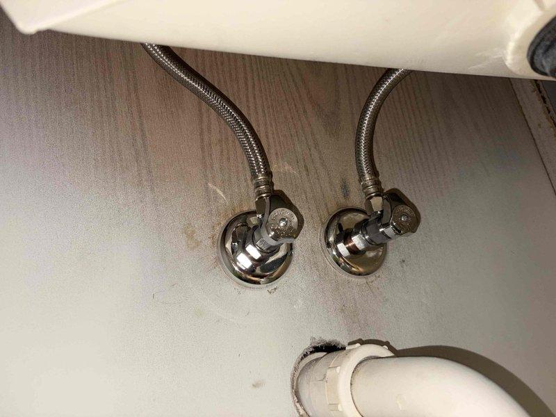 Replaced laundry sink and faucet assembly in residential setting. Removed existing fixtures and installed new sink basin with corresponding faucet hardware. Connected braided stainless steel flexible supply lines to wall-mounted shut-off valves with proper sealing to ensure leak-free operation.