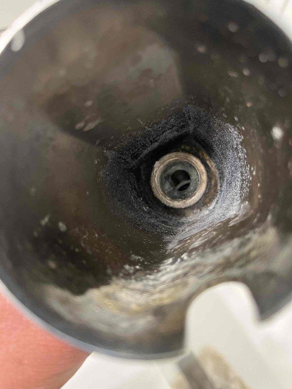 Cleared clogged tub drain by removing accumulated debris and buildup from the drain assembly. Additionally, replaced the worn shower diverter on the Moen tub and shower fixture to restore proper water flow control between the tub spout and showerhead.