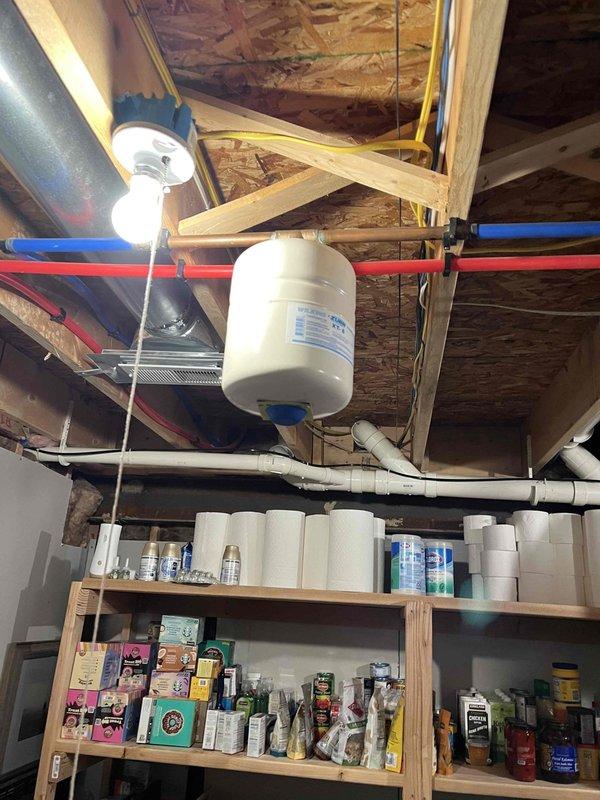 Completed routine plumbing membership inspection at residential property. Performed comprehensive visual assessment of bathroom fixtures including toilet, bathtub, and associated plumbing components, verifying proper operation and identifying no immediate concerns. Inspected basement utility area plumbing infrastructure, examining PEX water supply lines, expansion tank mounting and connections, and overhead piping distribution system, confirming all components were functioning within normal parameters with no visible leaks or deficiencies noted.