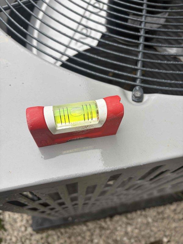 Completed follow-up service call for previously sold repair work on residential condensing unit. Verified outdoor air conditioning unit installation and proper leveling of equipment on composite pad. Confirmed refrigerant line insulation, electrical connections, and conduit mounting were secure and properly installed. Unit positioned correctly on gravel bed with adequate clearance from structure. All components functioning as intended with no issues identified during inspection.