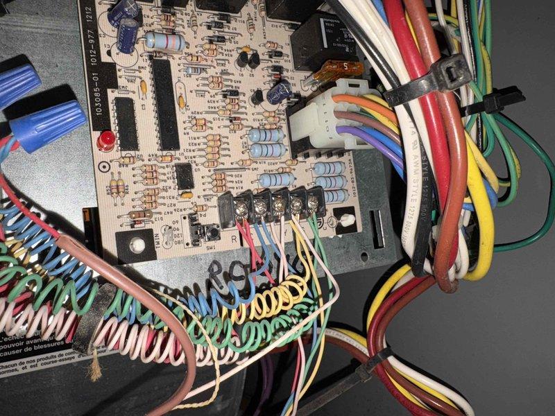 Conducted comprehensive site evaluation for HVAC system replacement on existing residential installation. Assessed current furnace/air handler unit located in basement utility area, documented existing configuration including PVC vent piping, electrical connections, and control board condition. Inspected electronic control board showing multiple circuit connections and functional components, photographed equipment specifications and manufacturer data plates for proper sizing and replacement recommendations. Customer has multiple HVAC units on property and requested estimate specifically for replacement of this single system.