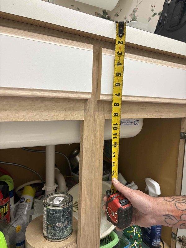 Performed site assessment for kitchen sink replacement project. Took precise measurements of existing cabinet interior dimensions and plumbing configuration, including vertical clearances and pipe positioning to ensure proper fitment of new fixtures. Customer requires special-order sinks to accommodate specific dimensional requirements identified during inspection.