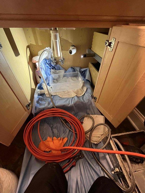 Responded to service call addressing multiple plumbing issues throughout the residence. Inspected and diagnosed two malfunctioning toilets requiring repair. Assessed refrigerator water supply line and determined the shut-off valve requires replacement due to wear or malfunction. 

Primary focus was master bathroom sink drain obstruction. Homeowner had previously attempted to clear blockage using drain snake with limited success. Upon inspection, confirmed severe clog caused by accumulated coconut oil buildup in drain line. Coconut oil solidifies at room temperature and creates stubborn blockages that resist standard mechanical snaking methods. Accessed plumbing beneath vanity cabinet and evaluated P-trap and supply line connections. Performed drain clearing procedures to address the oil-based obstruction in the drain system.