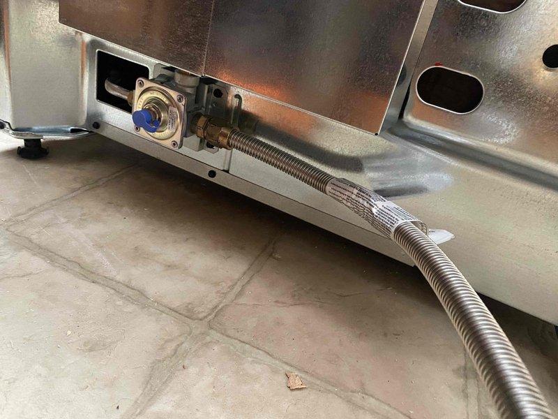 Completed rework of gas line installation for new range appliance. Installed flexible gas connector with proper fittings to ensure safe connection between gas supply and range unit, with stove delivery coordinated prior to final hookup appointment.