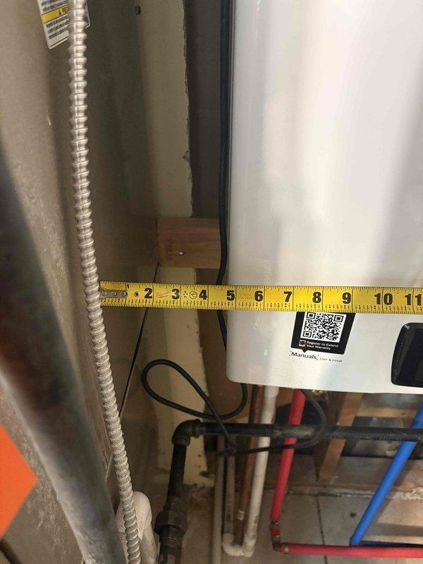 Conducted comprehensive evaluation of 30-year-old air conditioning system for replacement estimate. System has required multiple refrigerant recharges and operational status remains uncertain as unit has not been tested this season. Assessed existing equipment configuration, measured clearance dimensions in mechanical room, documented current installation including copper refrigerant lines, electrical conduit, and Nest thermostat wiring connections. Single-unit residential system evaluated for complete HVAC replacement recommendation.