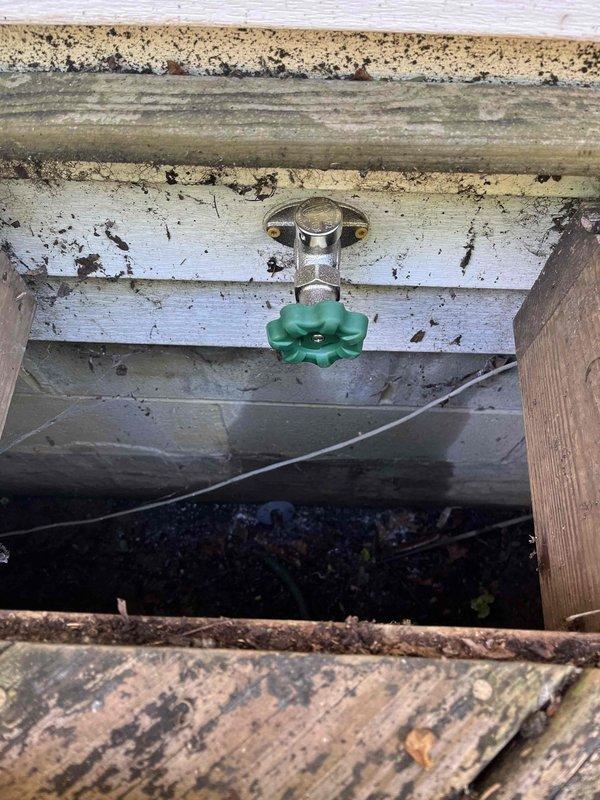 Replaced deteriorated outdoor hose bib at rear of structure, accessing fixture through existing deck access panel. Removed weathered spigot assembly with corroded mounting flange and installed new brass hose bib with proper sealing to prevent water intrusion. Verified proper operation and shutoff functionality upon completion.