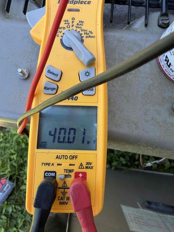 Completed routine AC maintenance and tune-up on residential air conditioning system. Performed comprehensive system inspection and diagnostic measurements using digital multimeter to verify proper electrical parameters and system operation. All measurements indicated normal operating conditions with temperature readings within acceptable range. Inspected outdoor condensing unit components, electrical disconnect box, and associated wiring. System found to be functioning properly with no issues identified. Unit age unknown but equipment operating efficiently. Maintenance completed successfully with system ready for continued operation.