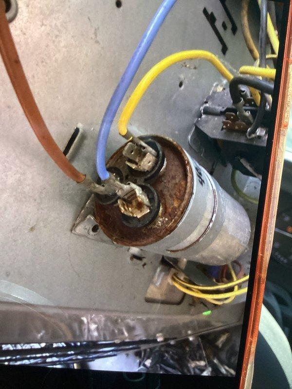 Completed routine cooling maintenance member visit on air handler unit. Upon inspection, discovered significant rust and corrosion on motor/capacitor assembly and mounting plate, affecting electrical connections and terminal blocks. Documented equipment condition with photos and performed system diagnostics, calculating superheat measurements to assess refrigerant charge and overall system performance.