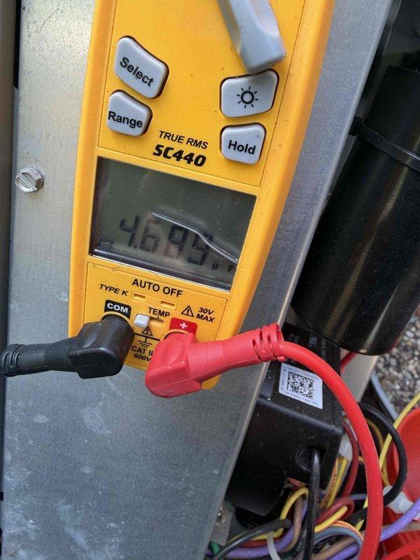 Completed cooling maintenance on two air handler units per club membership agreement. Performed comprehensive system diagnostics using digital multimeter to verify electrical parameters and measure voltage readings across components. All measurements confirmed proper operation within manufacturer specifications. Captured documentation of diagnostic readings showing system operating at 441V and 46.97V at respective test points. Inspected electrical connections, wiring bundles, and control circuits within air handler enclosures. Both units found operating normally with no deficiencies noted.