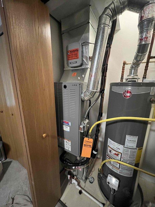 Completed full HVAC system installation including new air conditioning unit and evaporator coil in residential utility room. Installed new air handler with insulated refrigerant lines and flexible ductwork, integrated condensate drain assembly with PVC piping, and ensured proper connection to existing furnace system. All components tested and operational upon completion.