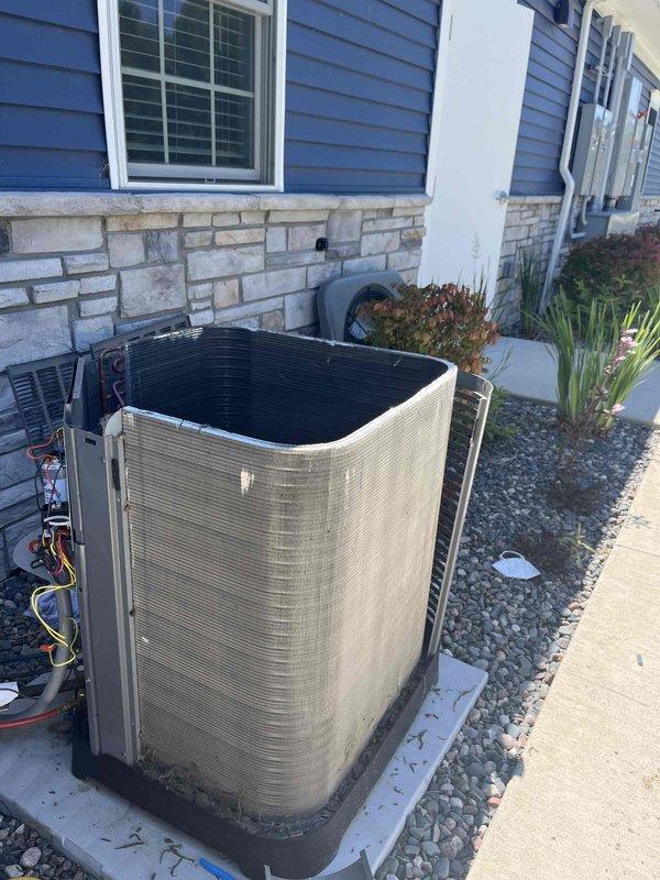 Responded to no cooling complaint on residential split system air conditioning unit. Upon arrival, found outdoor condensing unit operational but system not achieving adequate cooling performance. Inspected electrical compartment and identified failed run capacitor causing compressor to operate inefficiently. Replaced defective capacitor with proper OEM-rated replacement, verified all electrical connections secure, and tested system operation. Unit now cooling properly with normal temperature differential and amperage readings within manufacturer specifications.