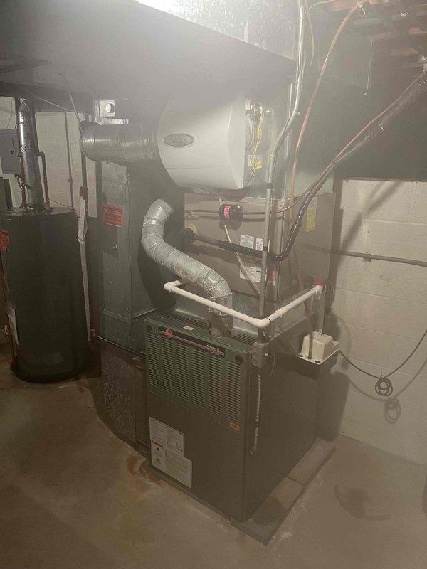 Responded to complaint of rotten egg odor in hot water at recently purchased residence. Inspected tanked water heater installation in basement utility room and evaluated water quality concerns. The sulfur smell typically indicates bacterial growth in the water heater tank or reaction between anode rod and water supply. Provided customer education on cause of odor and recommended treatment options including anode rod replacement or tank flushing. Additionally provided consultation and quotation for reverse osmosis water filtration system installation to address overall water quality concerns throughout the home.