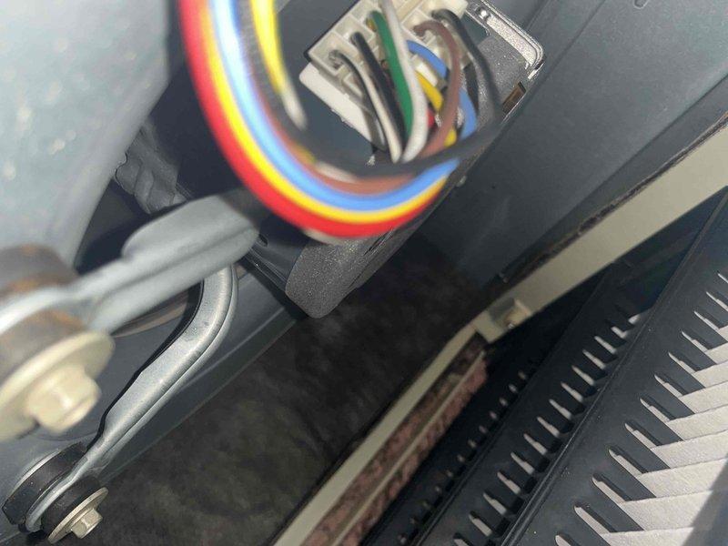 Completed scheduled cooling maintenance on air handler unit as part of membership club visit. Inspected electrical connections and control wiring, verified proper terminations at multi-pin connector block, and examined blower motor assembly including housing and shaft components to ensure optimal system operation for the cooling season.