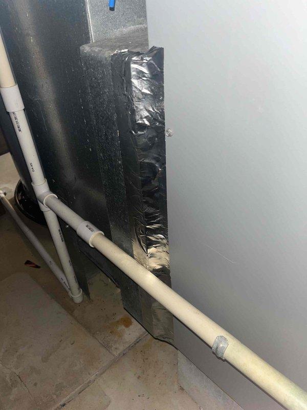 Responded to callback for continued condensate leak at air handler unit. Upon inspection, identified improper drainage at condensate line connection point. Repositioned and re-secured PVC condensate drain piping to ensure proper pitch for gravity drainage. Verified primary drain line was clear and flowing freely. Applied additional foam insulation to exposed refrigerant lines to prevent secondary condensation issues. Tested system operation and confirmed no active leaking at air handler or drain connections.