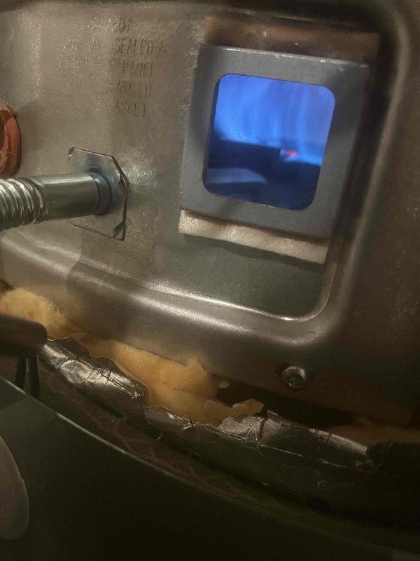 Returned to property to complete installation of flame rod assembly that was previously sold. Successfully installed new flame rod assembly on gas furnace unit. Verified proper ignition and flame sensing operation. Observed blue flame through viewing window, confirming efficient combustion and proper burner operation. Tested system through complete heating cycle to ensure reliable ignition and flame detection. Unit operating correctly with no fault codes present.