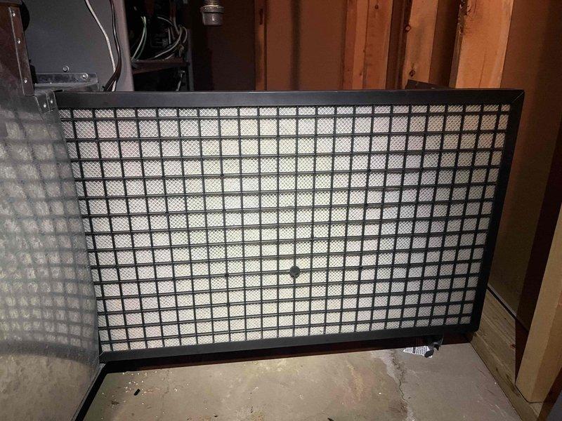 Completed HVAC club membership enrollment and performed system documentation. Inspected and photographed Aprilaire thermostat showing proper operation with display readings of 65° and 60°. Documented return air grate condition in mechanical space, noting standard installation with exposed framing in utility area.