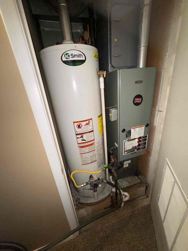 Returned to service location to complete installation of 40-gallon blanket-wrapped water heater with expansion tank. Verified all plumbing connections, including copper piping with brass fittings and pressure relief valve. Documented installation with pressure reading of 68 PSI on expansion tank and marked service date on equipment for future reference.
