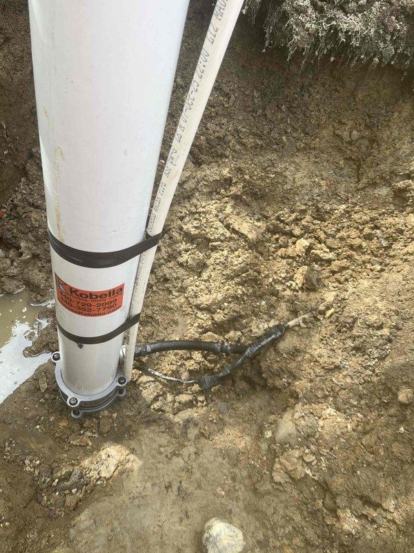 Completed installation of new well casing riser and pitless adapter assembly as previously sold. Excavated access trench to existing well system, removed old components, and installed white PVC riser pipe with proper coupling to underground water line. Secured new casing with mounting straps and backfilled excavation site upon completion of installation and system verification.